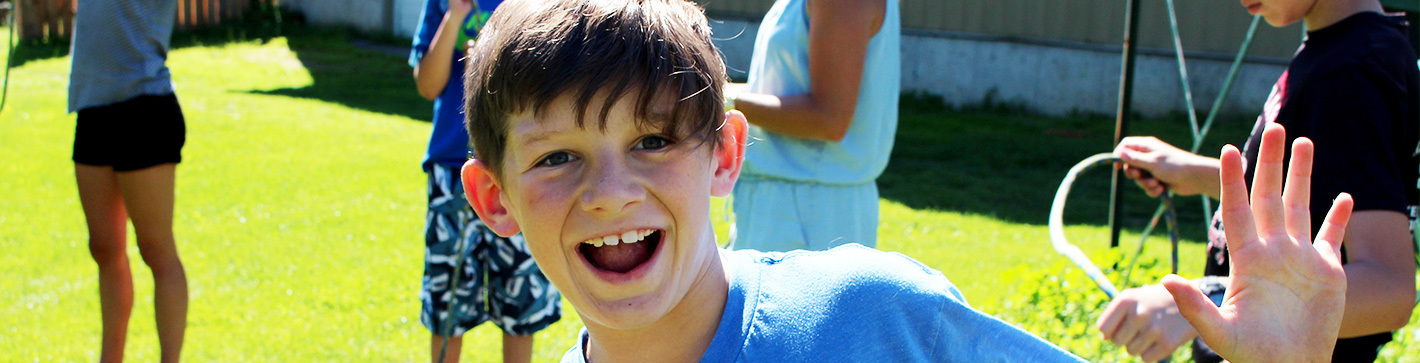 smiling boy with friends in the upper field